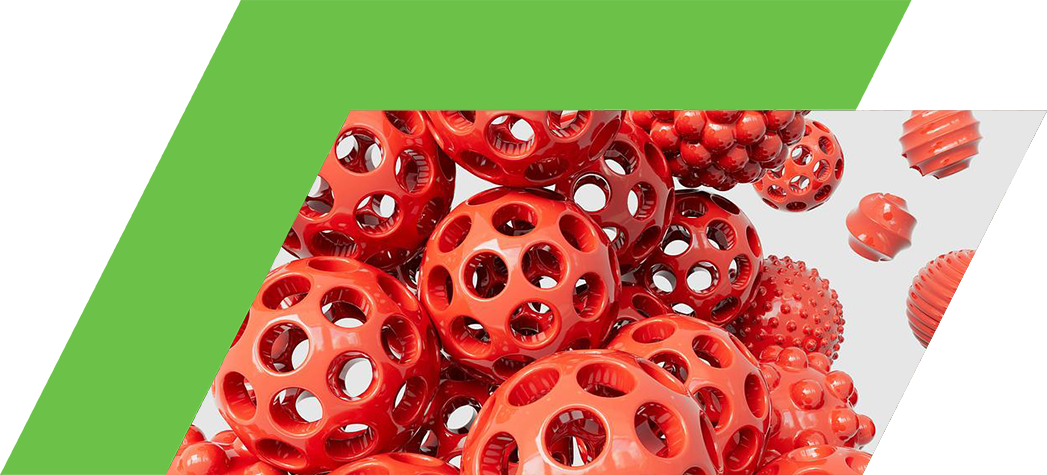 A cluster of red, glossy spheres with various textures and hole patterns against a light background.