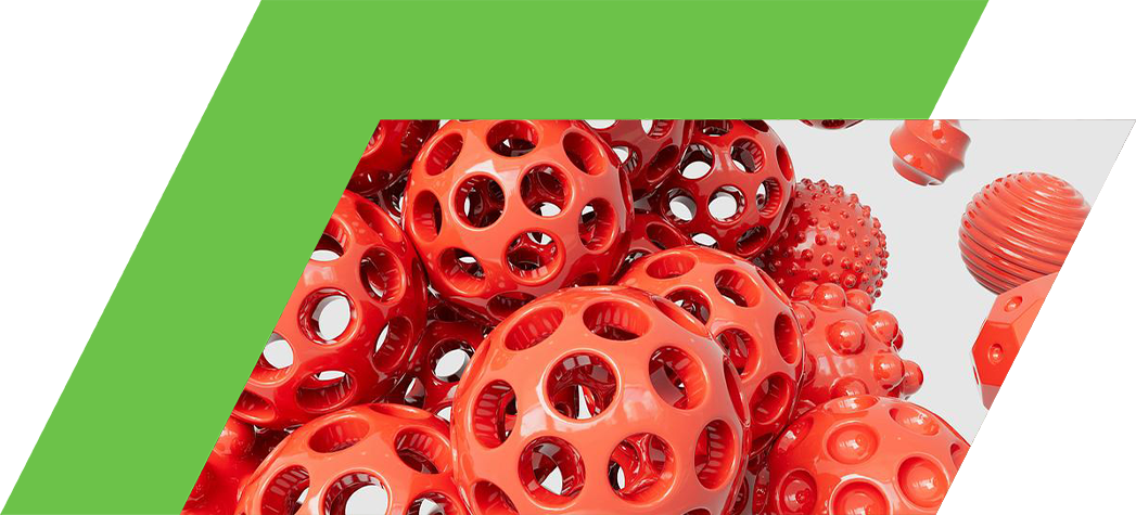 A cluster of glossy red spheres with various textures and hole patterns against a light gray background.