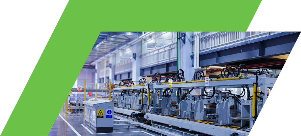 A modern industrial facility featuring advanced robotic machinery arranged along a clean, well-lit production line.