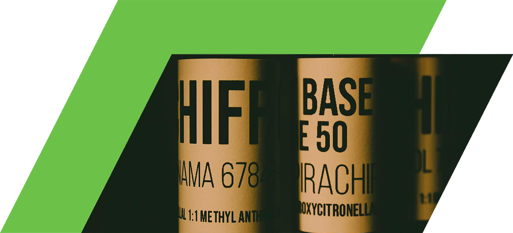 Close-up of dark bottles with labels indicating various chemical compounds and their concentrations.
