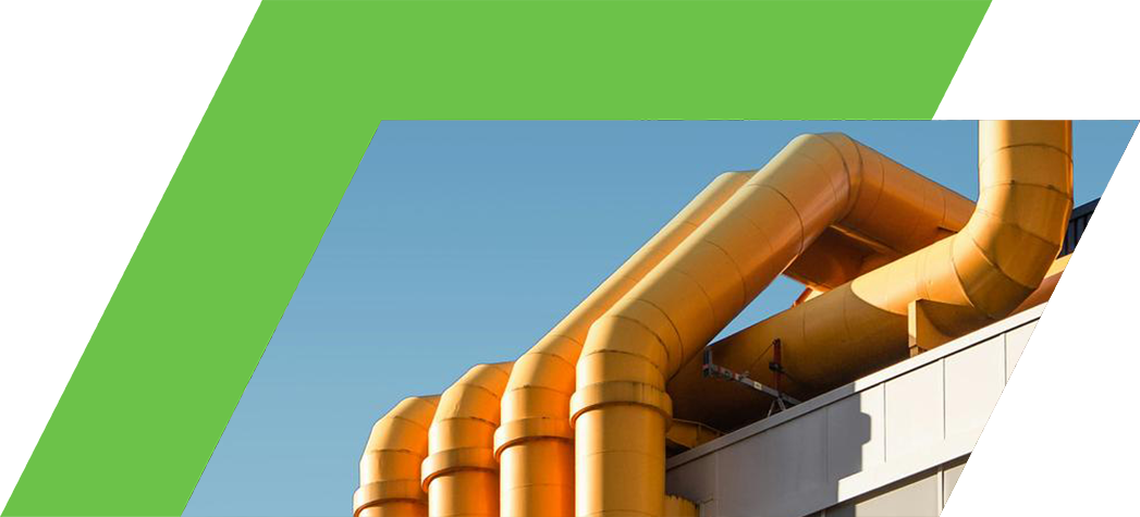 Yellow industrial pipes against a clear blue sky.