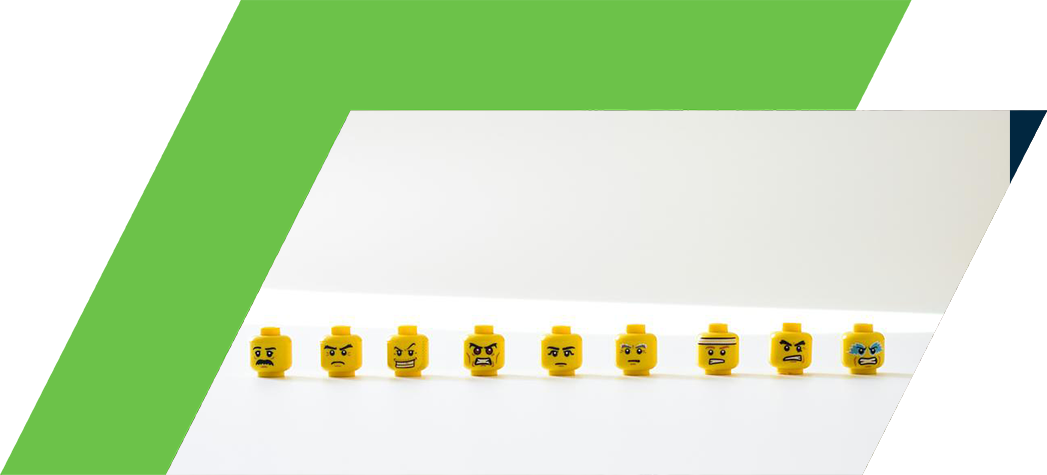 A row of eight yellow LEGO heads displaying various facial expressions.