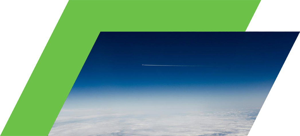 A high-altitude view of the sky with a jet leaving a contrail above a layer of clouds.