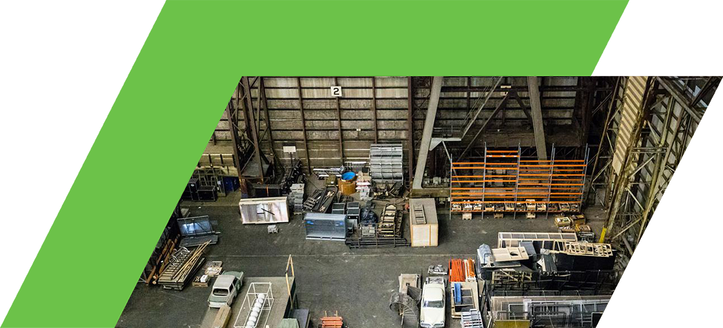 Aerial view of a large warehouse filled with various construction materials and equipment.