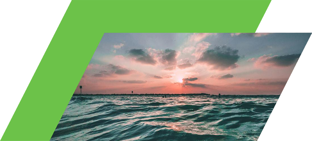 A serene seascape at sunset with gentle waves and a colorful sky filled with clouds.
