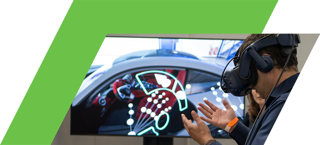 A person wearing a virtual reality headset interacts with a display showcasing a car interior.
