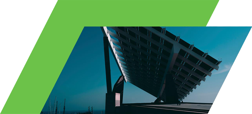 A large, modern solar panel structure tilts against a blue sky, casting a dramatic shadow.