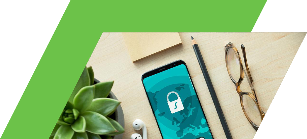 A smartphone displaying a secured screen is surrounded by a plant, earbuds, glasses, a pencil, and a notepad on a wooden surface.