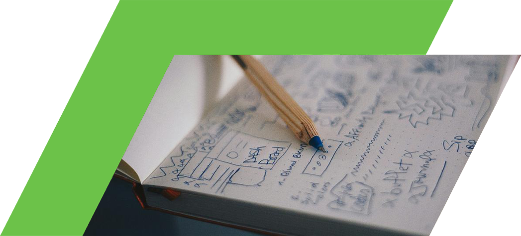 A close-up of an open notebook filled with handwritten notes and sketches alongside a wooden pencil.