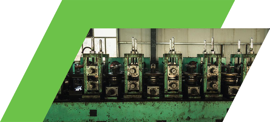 Industrial machinery with multiple hydraulic presses inside a factory setting.