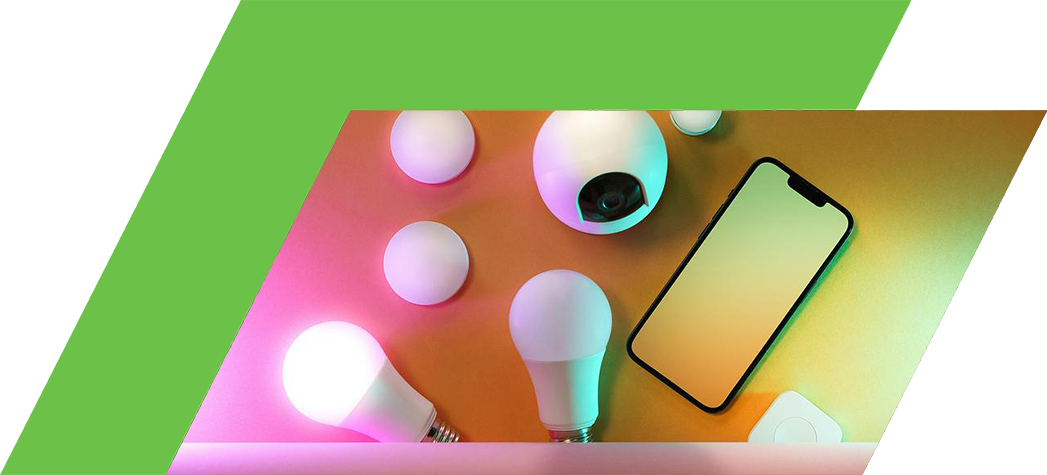 A flat lay image featuring various smart lighting devices and a smartphone against a colorful background.