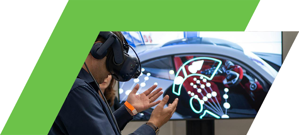 A person wearing a virtual reality headset interacts with a digital display showcasing a car interior.