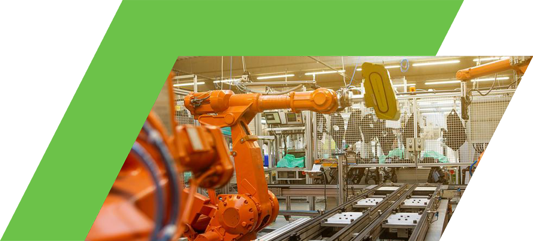 A modern industrial facility featuring multiple orange robotic arms working on an assembly line.