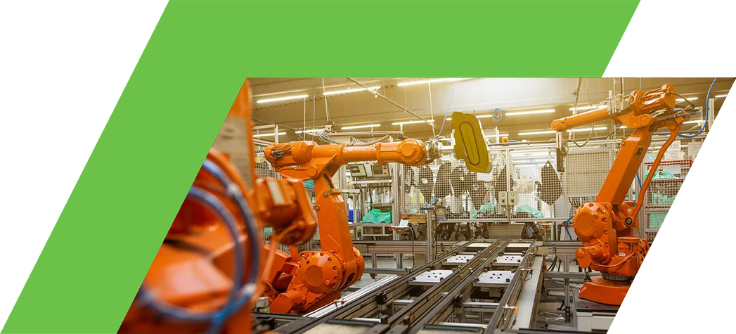 Industrial robotic arms working on a production line in a manufacturing facility.