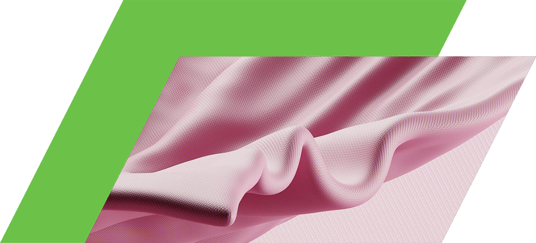 A close-up of soft pink fabric with gentle folds and a textured surface.