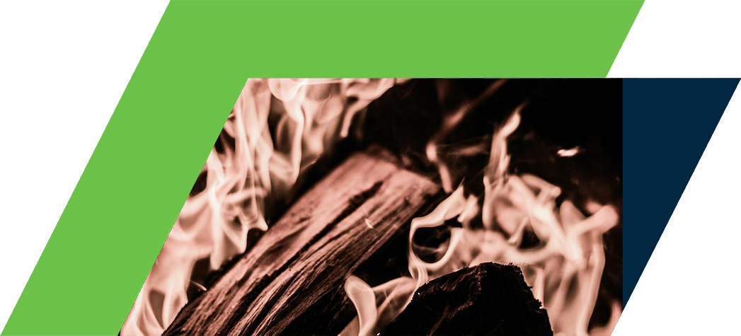 A close-up of flickering flames rising from burning wood.
