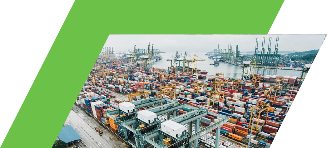 Aerial view of a busy shipping port filled with colorful cargo containers and cranes.