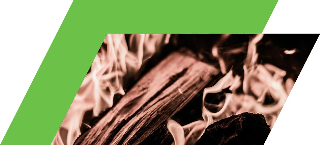 Flames dancing above a pile of burning wood.