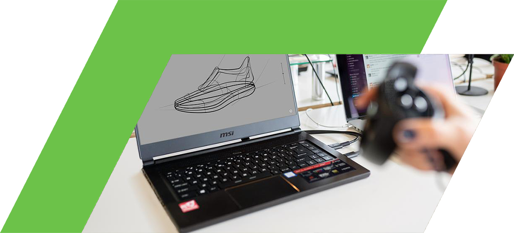 A laptop displaying a sketch of a shoe design, with additional computers and plants in a modern workspace.