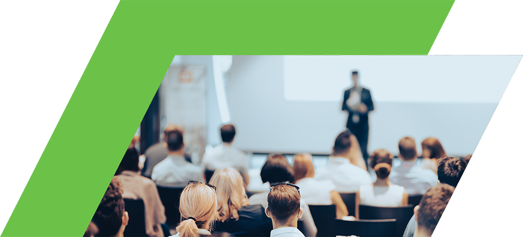 Business speaker giving a talk at business conference event.